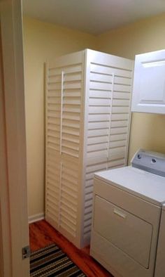 a washer and dryer in a small room