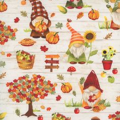 an autumn themed fabric with gnomes and pumpkins