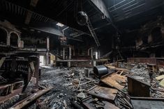 the interior of an abandoned building with lots of debris