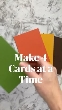 a hand holding four cards at a time with the words make 4 cards at a time