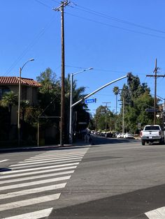 an intersection with traffic lights and street signs