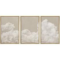 three framed pictures with clouds in the sky