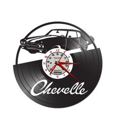 a clock with the word chevelle on it and a car in the background