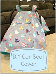 a car seat cover sitting on top of a table in front of a couch with a sign that says diy car seat cover