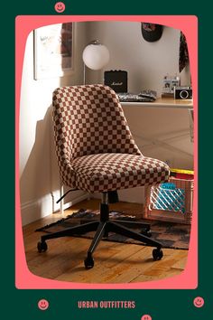 an office chair sitting on top of a hard wood floor next to a desk and lamp