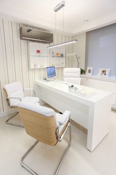 a white desk and chair in a room