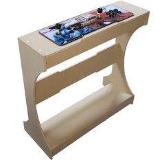 a wooden table with a video game on it