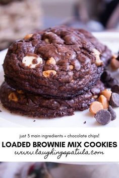 two chocolate cookies stacked on top of each other with the words loaded brownie mix cookies