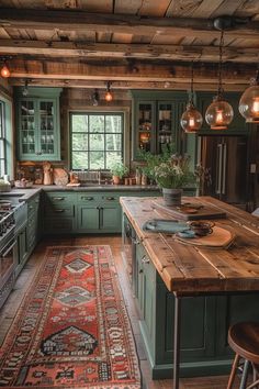 a kitchen with green cabinets and an area rug on the floor in front of it