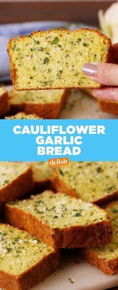 this is an image of garlic bread being held up by someone's hand with the text cauliflower garlic bread delish