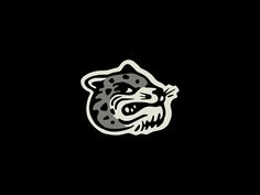 a black and white image of a tiger's head on a black background with the word