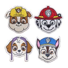 four patches with dogs wearing fire hats