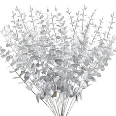 a vase filled with lots of silver leaves