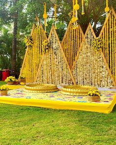 an outdoor ceremony with yellow and white decorations