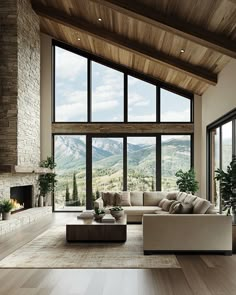 a living room filled with furniture and large windows