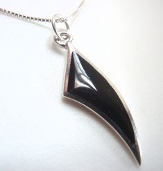 Shark Tooth-Shaped Simulated Black Onyx 925 Sterling Silver Necklace Small Metal: 925 Sterling Silver Stone: Simulated Black Onyx Pendant measures: Just over 1 by just over 1/4 inches (27 by 6.5 mm) 16 inch high-quality sterling silver chain (may be substituted for an 18 inch) Be sure to add me to your favorites list! Comes with a free gift box.* *Combined items will be shipped with one gift box. item: n4 Black Onyx Pendant, Teeth Shape, Onyx Pendant, Shark Tooth, Favorites List, Shark Teeth, Fine Jewellery Necklace, Sterling Silver Chain, Sterling Silver Necklace