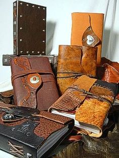 many different types of leathers are stacked on top of each other