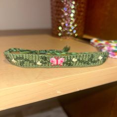 a green headband sitting on top of a wooden table