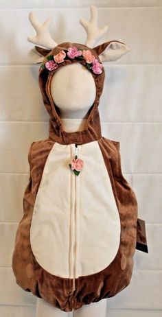 a child's deer costume with flowers on its head and antlers attached to it