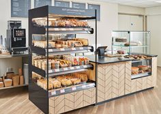 a display case in a bakery filled with lots of food