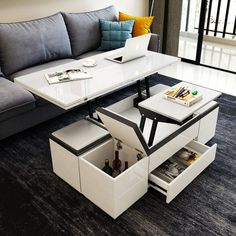 a modern coffee table with storage underneath it