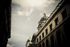 an old building with a dome on the top and sky in the backround