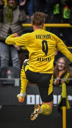 a soccer player is jumping in the air