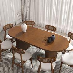 a large wooden table with white chairs around it