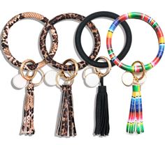 four different colored key chains with tassels