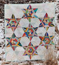 a quilted wall hanging in the snow