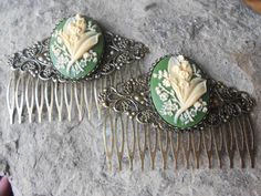 "Beautiful pair of lily of the valley cameo hair combs. The cameo is amazingly detailed and with gorgeous colors. The brushed bronze filigree hair comb is very pretty and about 3\" long, please see the photos. I have an enormous selection of cameos you can choose from for a custom order, so please do browse my shop, and feel free to message me. I have a wide selection of lockets, brooches, formal gloves, chokers, barrettes, necklaces, bracelets earrings, rings and matching sets. I can make a com Antique Hair Combs, Elven Jewelry, Hair Comb Accessories, Clay Polymer, Hair Combs, Funky Jewelry, Floral Hair, Dream Jewelry, Vintage Hairstyles