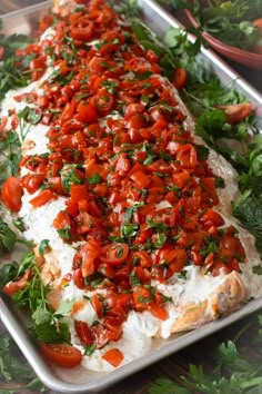 a platter filled with lots of food on top of a table