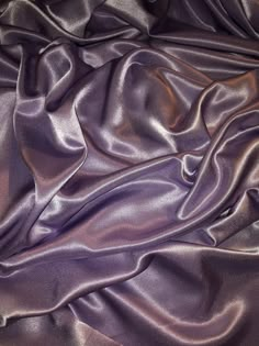 the fabric is very shiny and it looks to be dark purple or black color scheme