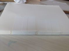 several sheets of white paper sitting on top of a table