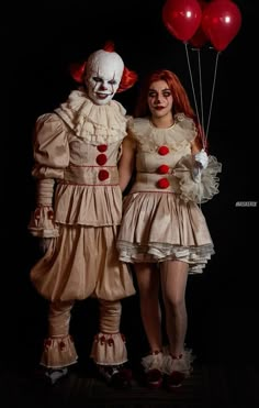 two people dressed up as clowns with red balloons in their hands and one wearing a white dress