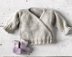 One of a kind hand knit baby wrap sweater with hand knit lavender socks. Size 0-3 months.  I used a soft Irish wool yarn. The color is a neutral grayish base with subtle hints of lavender, blue and cream. The sweater has a good amount of stretch. The wrap style is easy to put on and off with two snap closures. The style and color are gender neutral.  The sweater pairs well with jeans, leggings, sweats or as a layering piece. A great staple for a baby's wardrobe. Great for all seasons. This makes a great home coming outfit for a newborn baby. Or a sweet outfit to show off your new bundle of joy! A wonderful baby gift and heirloom piece. The lavender socks are super easy to put on. The cuff can be left high or rolled down.  Comes in a handmade fabric bag with lavender sachet. Free shipping. Lavender Socks, Knit Wrap Sweater, Bootie Socks, Alpaca Wool Sweater, Handmade Fabric Bags, Winter Baby Clothes, Knitted Baby Cardigan, Knit Baby Booties, Knit Baby Sweaters