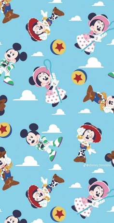 mickey and minnie mouses are flying through the sky