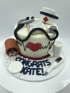 a cake that is decorated to look like a doctor's hat and stethoscope