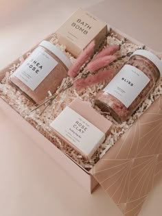 the bath gift box contains three different types of soaps and body scrubs in it