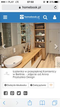 a bathroom with a sink and wooden cabinets