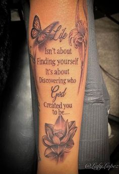 a woman with a tattoo on her arm that says, isn't about finding yourself it's about discovering who god created you to be