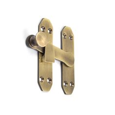 two brass door handles on a white background