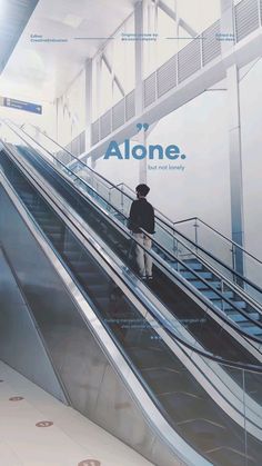 a man riding an escalator down the side of a building