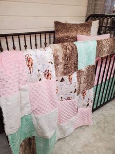 a baby crib with several blankets on it