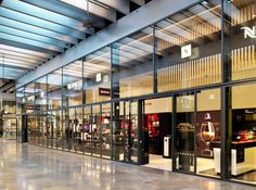 the inside of a store with glass walls