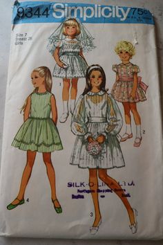 an image of children's dress patterns on the front and back of a sewing pattern