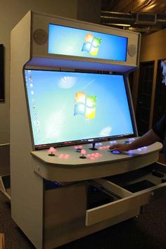 a person standing in front of a computer screen