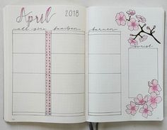 an open planner with pink flowers on it