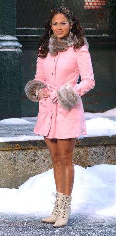 a woman in a pink coat and fur collar