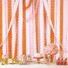 an orange and pink birthday party with decorations